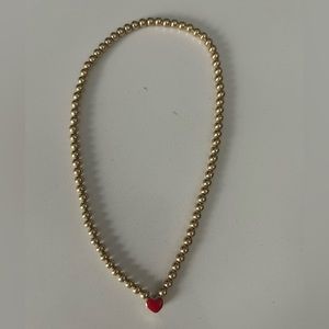 Alexa Leigh necklace. One side red heart other side blue. Good condition